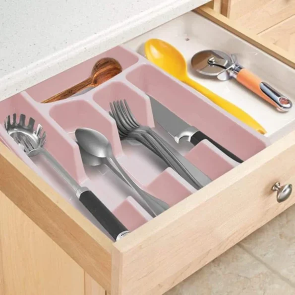 Multi compartment cutlery holder draining organiser sorting spoons and forks cleanly on a kitchen counter