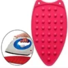 Blue heat resistant silicone iron pad rest mat holding a hot flat iron safely