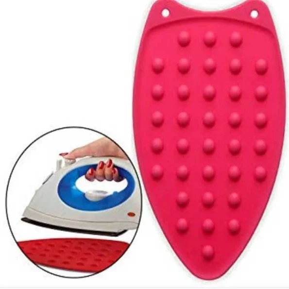 Blue heat resistant silicone iron pad rest mat holding a hot flat iron safely