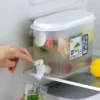 Clear 2.4L plastic cold juice beverage dispenser with a white dispensing tap sitting on a counter.