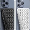 Washable reusable double sided suction pad holding a phone on a mirror surface