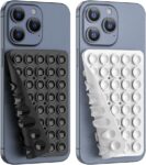 Washable reusable double sided suction pad holding a phone on a mirror surface