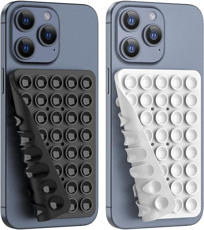 2026/07/1002113184.jpg Washable reusable double sided suction pad holding a phone on a mirror surface