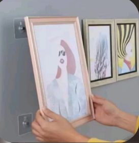 Screenshot 2026-07-08 001315 Heavy duty adhesive wall hook holding a photo frame close up